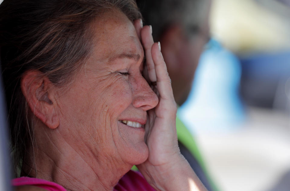 Nancy Register cries in her vehicle after losing her home to Hurricane Michael in Mexico Beach, Fla., Wednesday, Oct. 17, 2018. She said she doesn't know how they are going to make it through this and that they only have money to last them four more days. (AP Photo/Gerald Herbert)