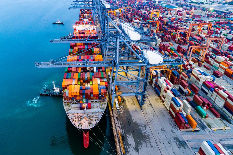 The aerial view shot container warehouse and the harbour.