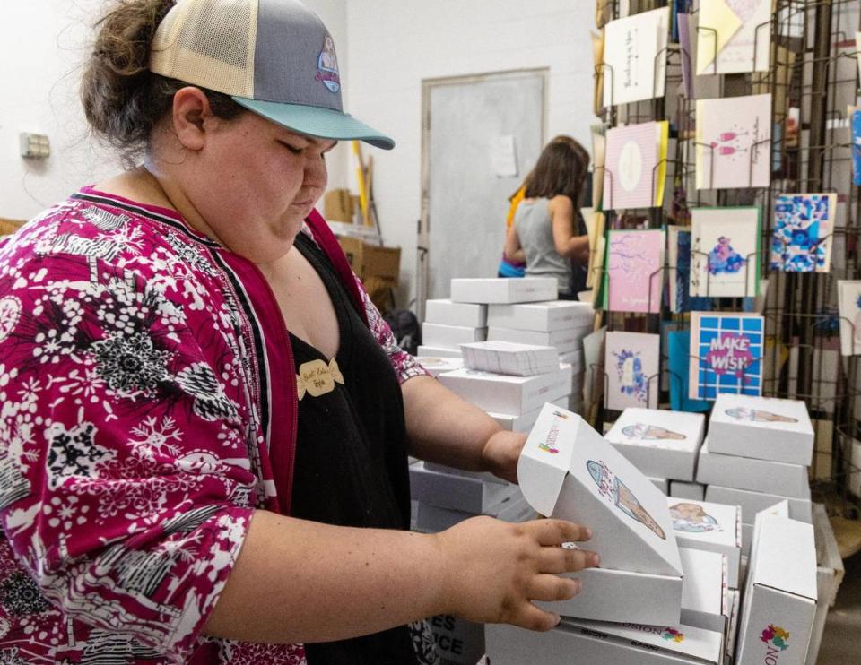 Sweet Zola’s Candy & Gift Shop employee Evie Heckthorn packs monthly subscription boxes at the store in Boise on Saturday. Sarah A. Miller/Sarah A. Miller