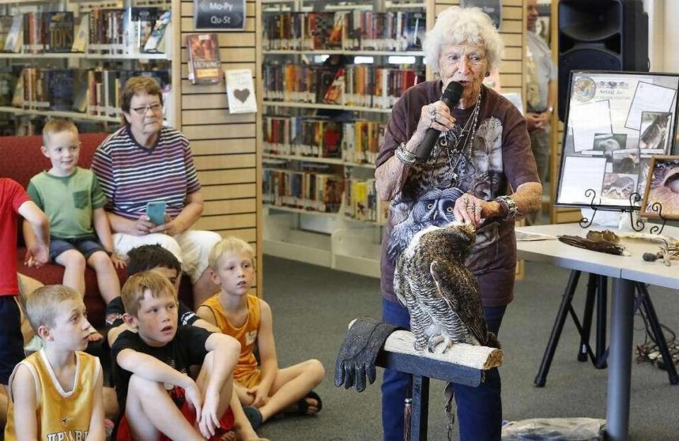 Doris Mager and her great horned owl, E.T., visit the West Richland branch of the Mid-Columbia Libraries.