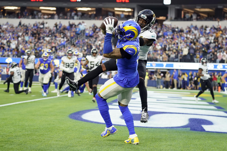 Los Angeles Rams wide receiver Odell Beckham Jr. makes a touchdown catch over Jacksonville Jaguars cornerback Nevin Lawson during the second half of an NFL football game Sunday, Dec. 5, 2021, in Inglewood, Calif. (AP Photo/Jae C. Hong)