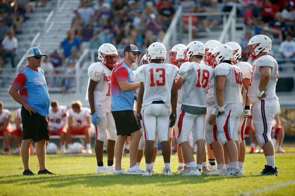 Glendale interim head coach Joel Heman, left, and offensive coordinator Maty Mauk, speaking with players, seen here the Football Jamboree at Fair Grove High School on August 18, 2023.
(Credit: Bruce Stidham Special to the News-Leader)