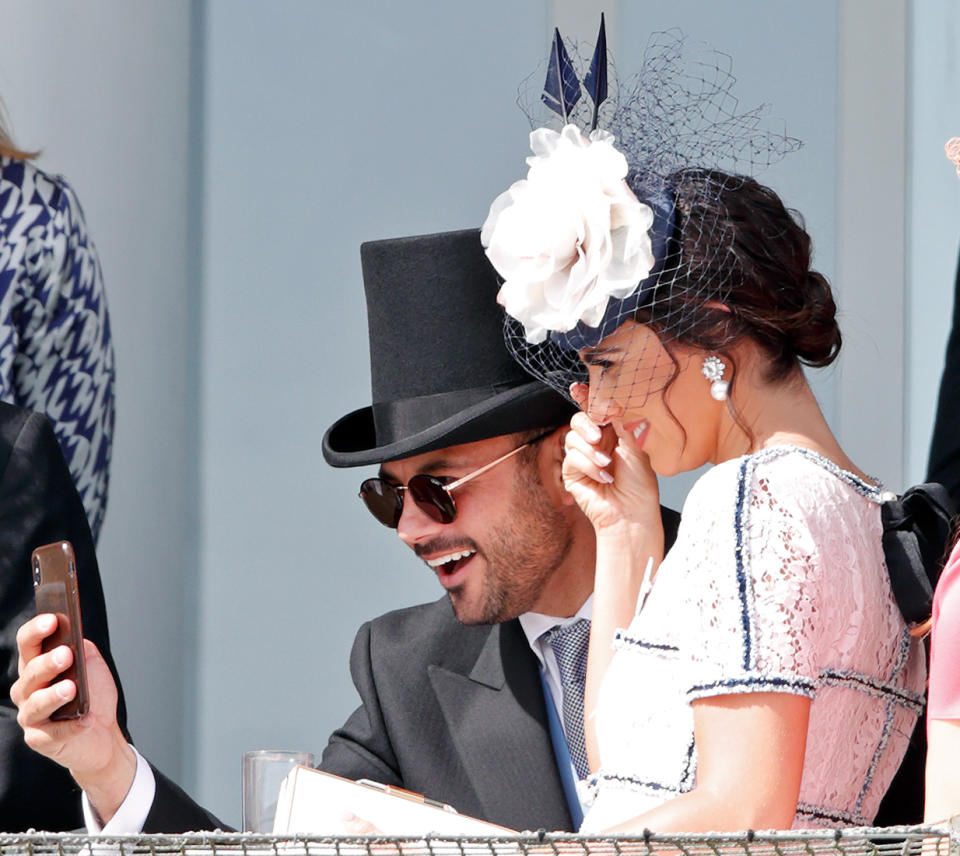 EPSOM, UNITED KINGDOM - JUNE 01: (EMBARGOED FOR PUBLICATION IN UK NEWSPAPERS UNTIL 24 HOURS AFTER CREATE DATE AND TIME) Ryan Thomas and Lucy Mecklenburgh watch the racing as they attend 'Derby Day' of the Investec Derby Festival at Epsom Racecourse on June 1, 2019 in Epsom, England. (Photo by Max Mumby/Indigo/Getty Images)