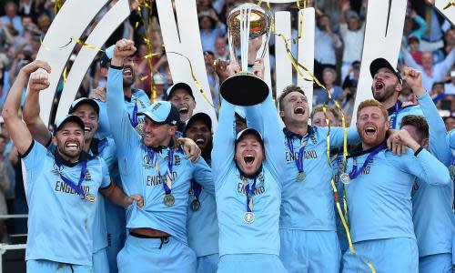 FILES-CRICKET-ENG-MORGAN<br>(FILES) In this file photo taken on July 14, 2019 England's captain Eoin Morgan lifts the World Cup trophy on the pitch after the 2019 Cricket World Cup final between England and New Zealand at Lord's Cricket Ground in London. - England's World Cup-winning captain Eoin Morgan is set to retire from international cricket, with an official announcement expected as soon as Tuesday, June 28, according to the BBC. (Photo by Glyn KIRK / AFP) / RESTRICTED TO EDITORIAL USE (Photo by GLYN KIRK/AFP via Getty Images)