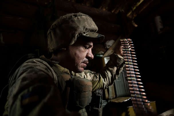 PHOTO: A Ukrainian serviceman of 28th prepares ammunition for the machine-gun at the frontline in Donetsk region, Ukraine, Wednesday, June 21, 2023. (Evgeniy Maloletka/AP)