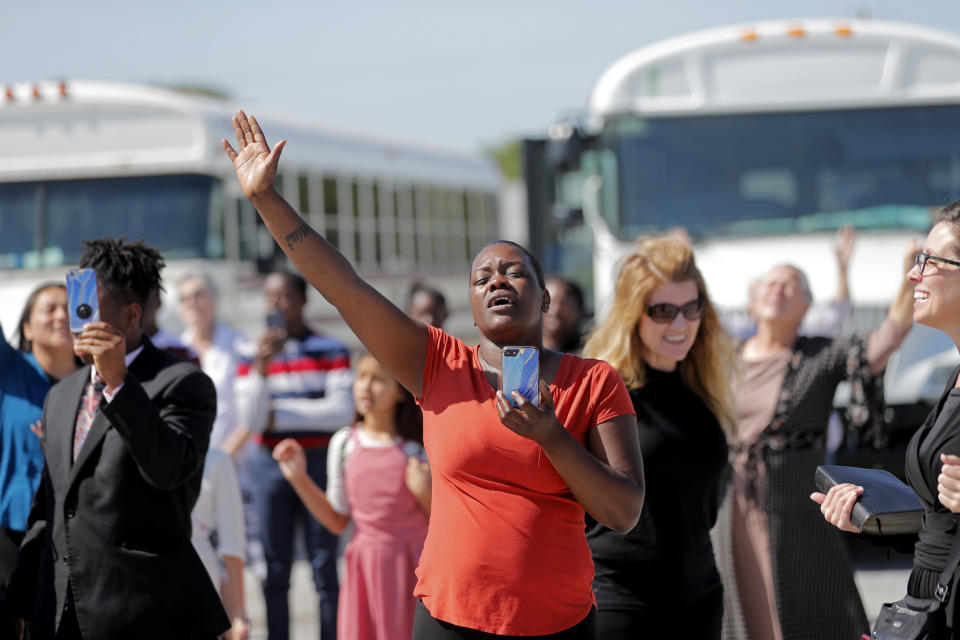 Image: Members of the Life Tabernacle Church sing songs as they wait for pastor Tony Spell to leave the East Baton Rouge Jail in Louisiana on April 21, 2020. (Gerald Herbert / AP)