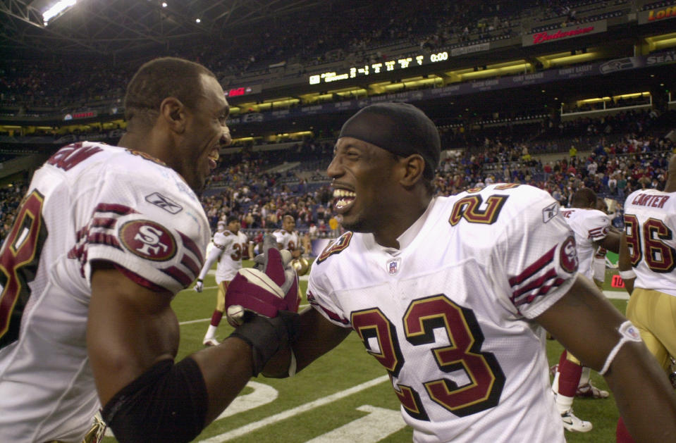 SEATTLE - OCTOBER 14:  Jimmy Williams #23 and Julian Peterson #98 of the San Francisco 49ers celebrate against the Seattle Seahawks during the game on October 14, 2002 at Seahawks Stadium in Seattle, Washington.  The 49ers won 28 -21.  (Photo by Otto Greule Jr/Getty Images)