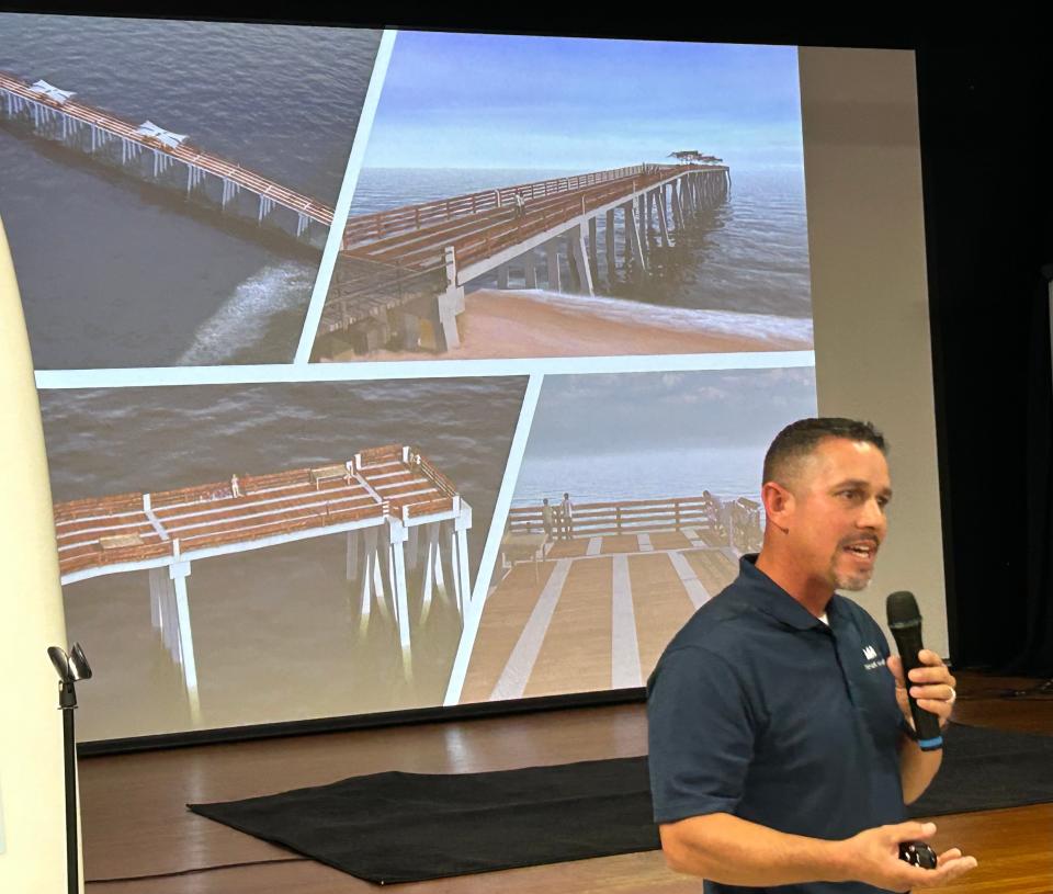 Gabriel Perdomo, a coastal engineer with Moffatt & Nichol, discusses the new pier while a rendering of the new pier is presented on the screen behind him at a town hall meeting Tuesday in Flagler Beach.