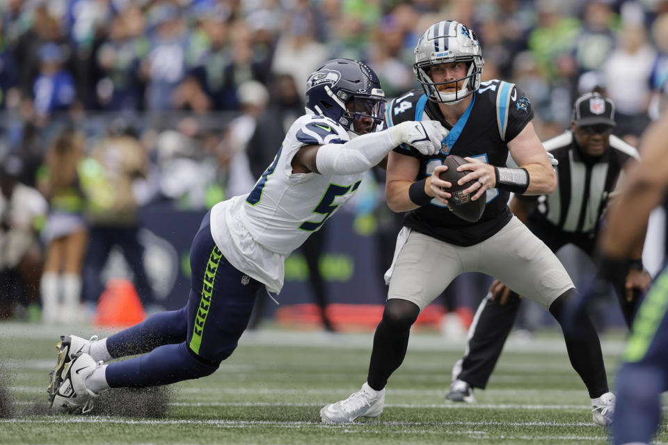 Carolina Panthers quarterback Andy Dalton is sacked by Seattle Seahawks linebacker Boye Mafe during the first half of an NFL football game Sunday, Sept. 24, 2023, in Seattle. (AP Photo/John Froschauer)