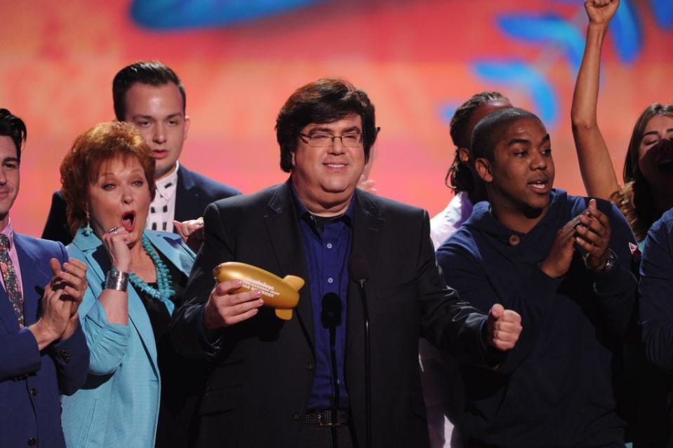 Dan Schneider accepts the Lifetime Achievement Award onstage with actors Maree Cheatham and Christopher Massey during Nickelodeon's 27th Annual Kids' Choice Awards on March 29, 2014.