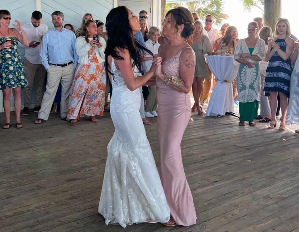 Sam Miller and her mother Lisa Miller dance at Sam’s wedding reception last Friday in Folly Beach, South Carolina.