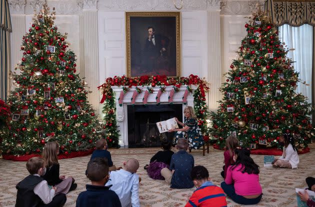 Biden reads to students from Malcolm Elementary School during the unveiling of the holiday decorations Monday. (Photo: ANDREW CABALLERO-REYNOLDS via Getty Images)