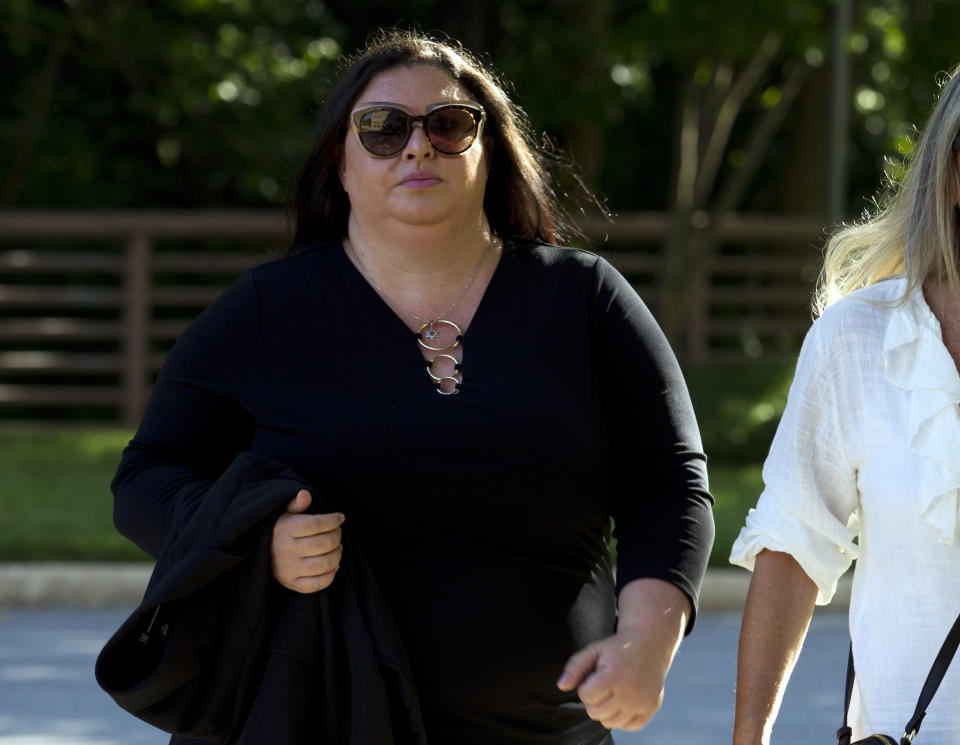 Lee Elbaz arrives at federal court for jury selection in her trial in Greenbelt, Md., Tuesday July 16, 2019. Elbaz was CEO of an Israel-based company called Yukom Communications. She is accused of engaging in a scheme to dupe investors through the sale and marketing of financial instruments known as "binary options." (AP Photo/Jose Luis Magana)