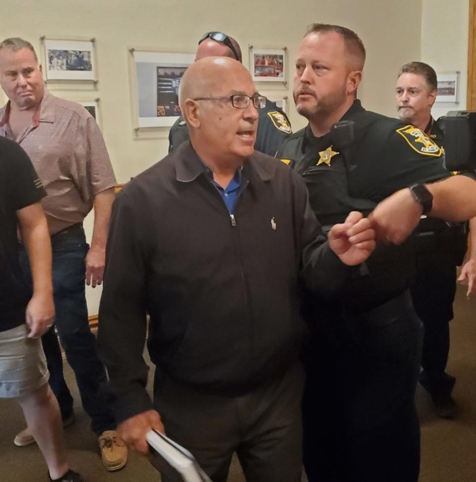 Several community members were ejected by local law enforcement at Tuesday's school board hearing on library materials.