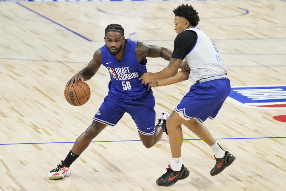 Jamal Shead, left, drives against Boogie Ellis during the 2024 NBA basketball Draft Combine in Chicago, Tuesday, May 14, 2024. (AP Photo/Nam Y. Huh)