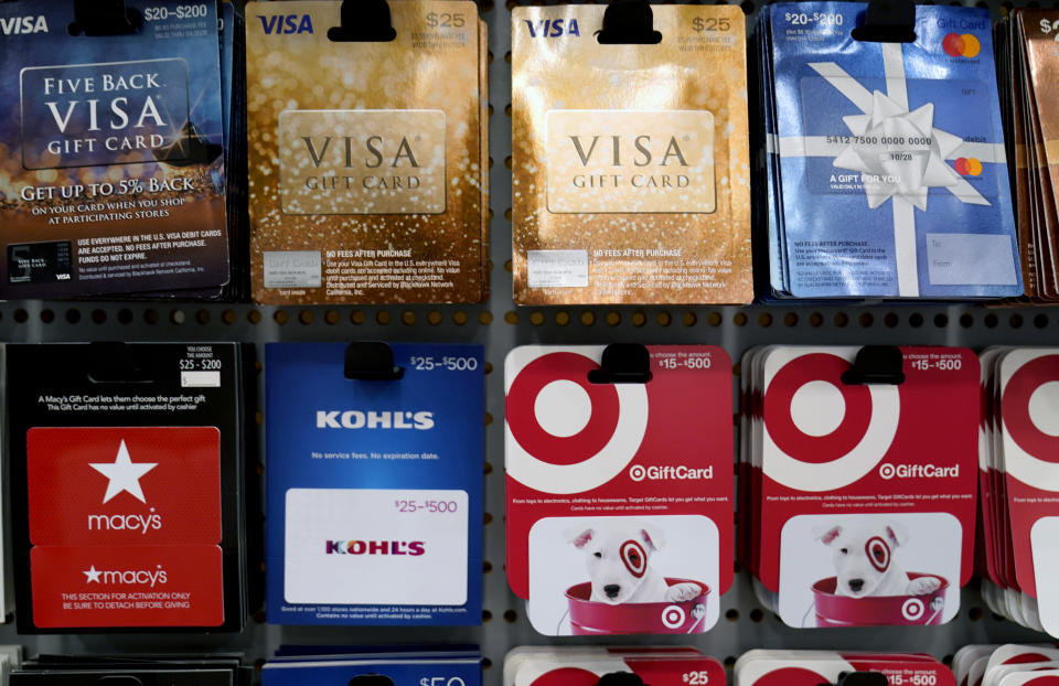 Gift cards sit on display for sale at a retail store in Dallas, Tuesday, Nov. 16, 2021. The holidays have always been defined by disappointing out-of-stock messages on the most popular items. Many shoppers will turn to more to gift cards if they don't like what they see. (AP Photo/LM Otero)