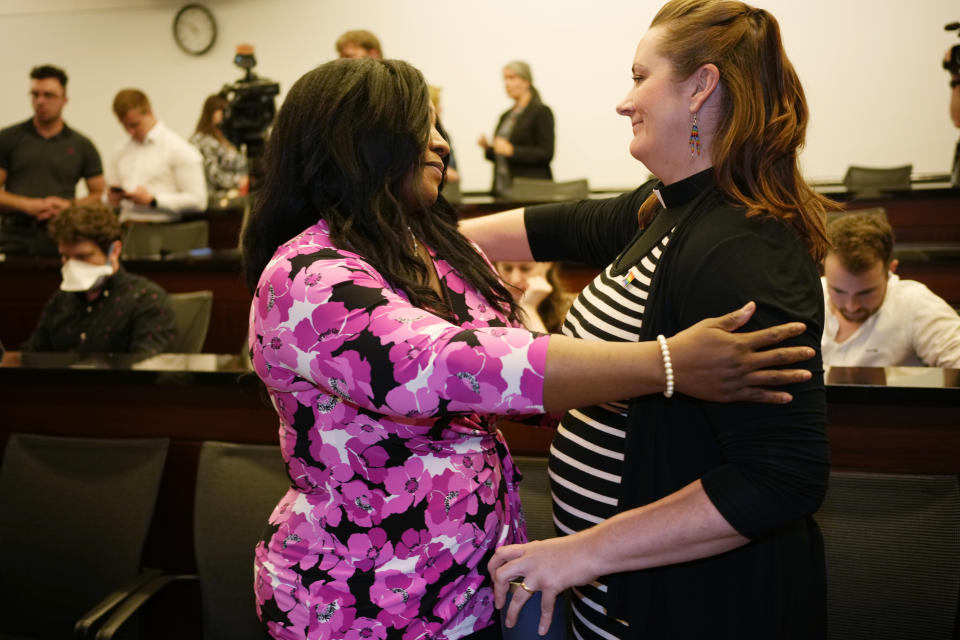 Shara Smith, left, chief executive officer of the Interfaith Alliance of Colorado, hugs Rev. Dr. Jenny Whitcher after a news conference, Friday, June 30, 2023, in Denver, about the U.S. Supreme Court ruling that allows a Colorado Christian graphic artist who wants to design wedding websites to refuse to work with same sex couples. (AP Photo/David Zalubowski)