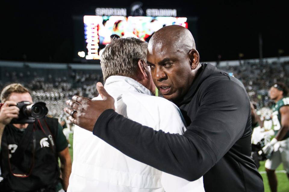 Michigan State head coach Mel Tucker hugs Central Michigan head coach Jim McElwain after 31-7 win at Spartan Stadium in East Lansing on Friday, Sept. 1, 2023.