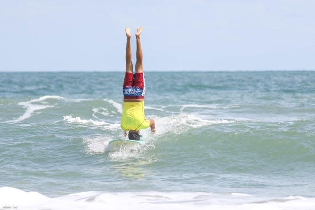 Cocoa Beach Mayor Keith Capizzi surfs during the 38th Annual NKF Rich Salick Pro-Am Surf Festival.