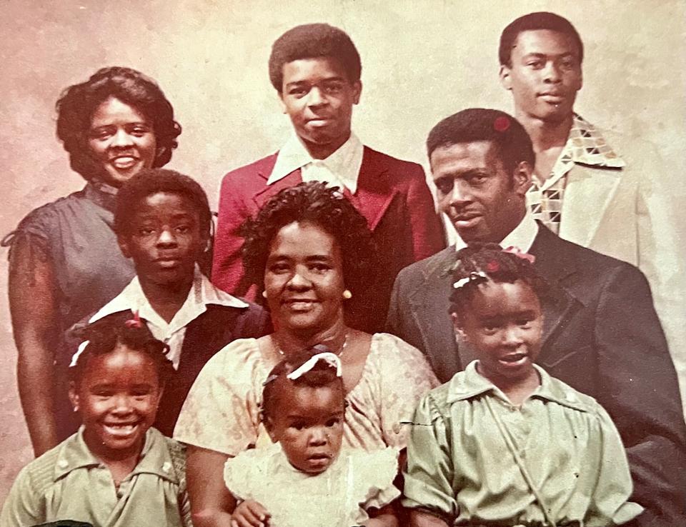Todd Suttles' family around 1979 at the Pine Motel in their hometown of Lafayette, Ga. Todd Suttles, around 11, is center left. Top row, left to right, his sister, Pamela Wright, a high school valedictorian that year, his brother, Sherman, a mechanic, his brother, Major (now retired from Navy). Middle row, left to right: Todd Suttles, his mom, Julia, and his dad, Paul, who died in 2020. Bottom row, left to right: his sister Lucrenia, who died in 1996, his sister, Tracia, his sister Lugenia, assistant principal at their alma mater, Lafayette high school