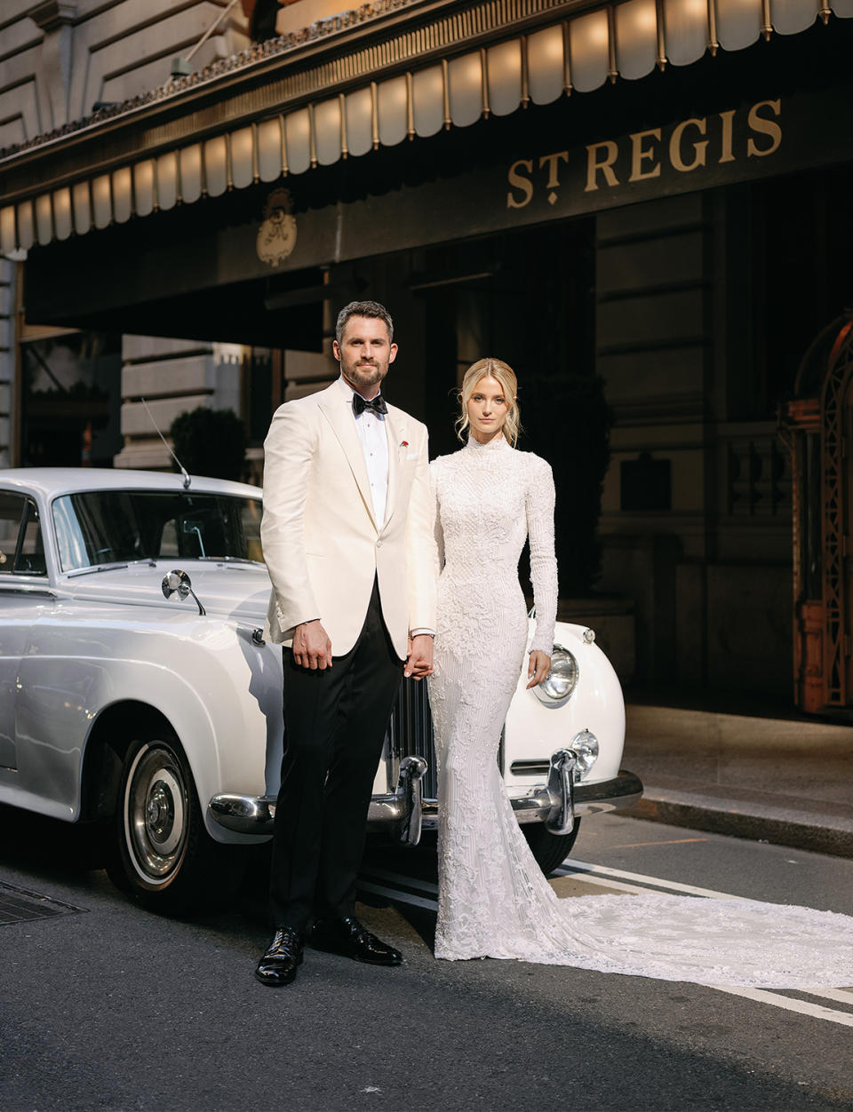 <p>The couple take photos outside the N.Y.C.'s iconic St. Regis hotel where they had their first date. </p>