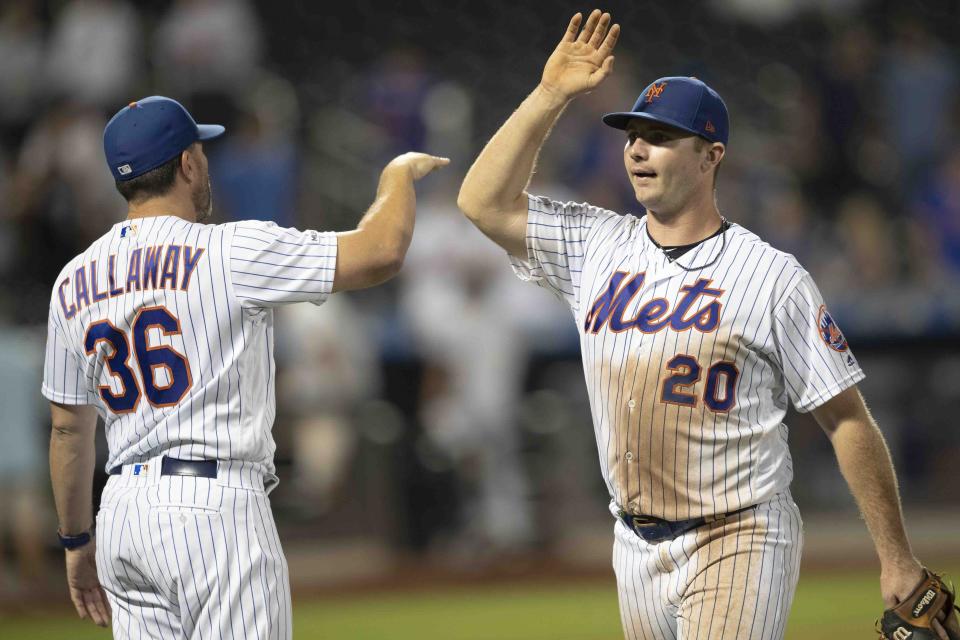 New York Mets' Pete Alonso (20) and Mickey Callaway (36) celebrate the team's 5-0 win over the Miami Marlins in a baseball game Tuesday, Aug. 6, 2019, in New York. (AP Photo/Mary Altaffer)