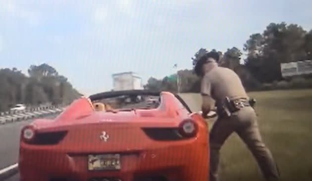 Dashcam footage shows Flagler County Commission Chairman Joe Mullins' red Ferrari during a traffic stop. (Photo: YouTube/FlaglerLive)