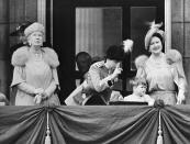 <p>Just months before she ascended to the throne, Princess Elizabeth watchs the annual Trooping the Colour with her eldest son, Prince Charles, accompanied by Queen Mary, left, and Queen Elizabeth, right. (Intercontinentale/AFP/Getty)</p> 