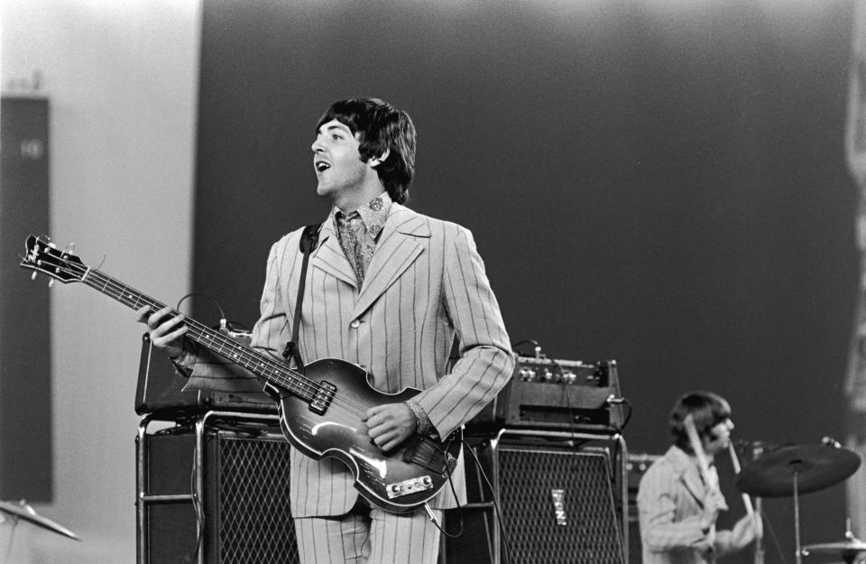 1966, British rock musician Paul McCartney playing on stage during The Beatles', last tour. Drummer Ringo Starr is visible in the background. (Photo by Getty Images/Getty Images)