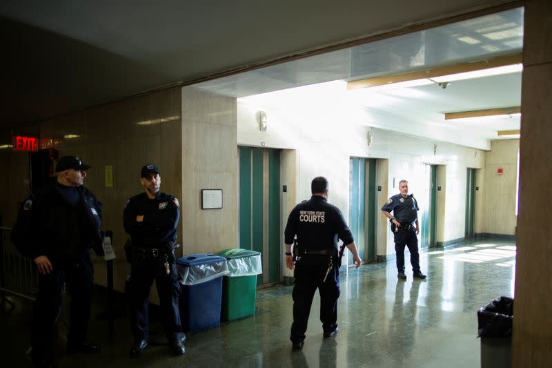 New York State Court Police officers wait for the arrival of film producer Harvey Weinstein during the ongoing sexual assault trial at New York Criminal Court in the Manhattan borough of New York City, New York