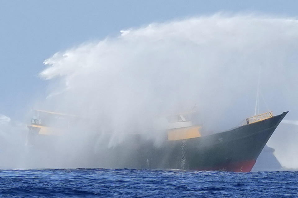 Philippine resupply vessel Unaizah May 4 is hit by two Chinese coast guard water canons as they tried to enter the Second Thomas Shoal, locally known as Ayungin Shoal, in the disputed South China Sea Tuesday, March 5, 2024. Chinese and Philippine coast guard vessels collided in the disputed South China Sea and four Filipino crew members were injured in high-seas confrontations Tuesday as Southeast Asian leaders gathered for a summit that was expected to touch on Beijing's aggression at sea. (AP Photo/Aaron Favila)