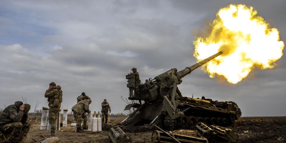 Ukrainian servicemen fire a howitzer cannon aimed at Russian positions on the front line nearby Bakhmut in Chasiv Yar, Ukraine on March 17, 2023.