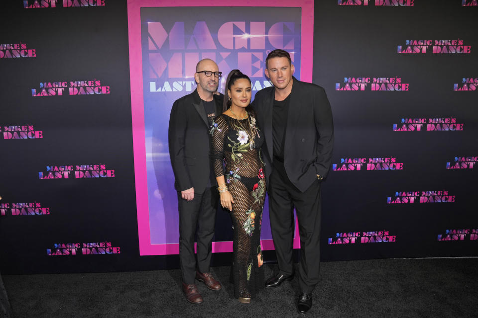 Director Steven Soderbergh, left, poses with actors Salma Hayek, center, and Channing Tatum on the red carpet at the premiere of the movie, "Magic Mike's Last Dance," Wednesday, Jan. 25, 2023, in Miami Beach, Fla. (AP Photo/Wilfredo Lee)