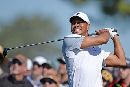 Tiger Woods hits his drive on the 12th during the first round of the Farmers Insurance Open golf tournament at Torrey Pines Municipal Golf Course - South Co. Mandatory Credit: Jake Roth-USA TODAY Sports