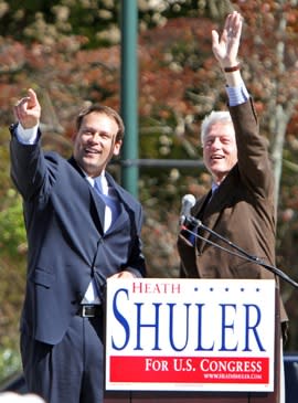 Heath Shuler stands with Bill Clinton at a campaign event.