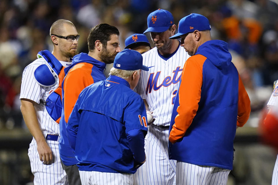 New York Mets starting pitcher Max Scherzer hands the ball to manager Buck Showalter during the sixth inning of the team's baseball game against the St. Louis Cardinals on Wednesday, May 18, 2022, in New York. (AP Photo/Frank Franklin II)