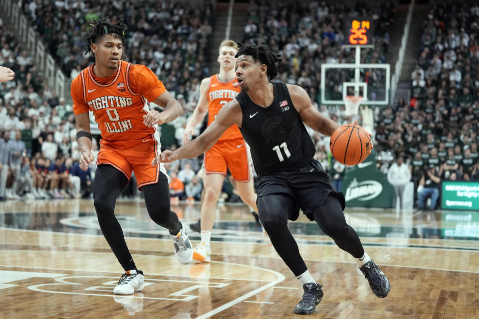 Michigan State guard A.J. Hoggard (11) brings the ball up court during the second half of an NCAA college basketball game against Illinois, Saturday, Feb. 10, 2024, in East Lansing, Mich. (AP Photo/Carlos Osorio)