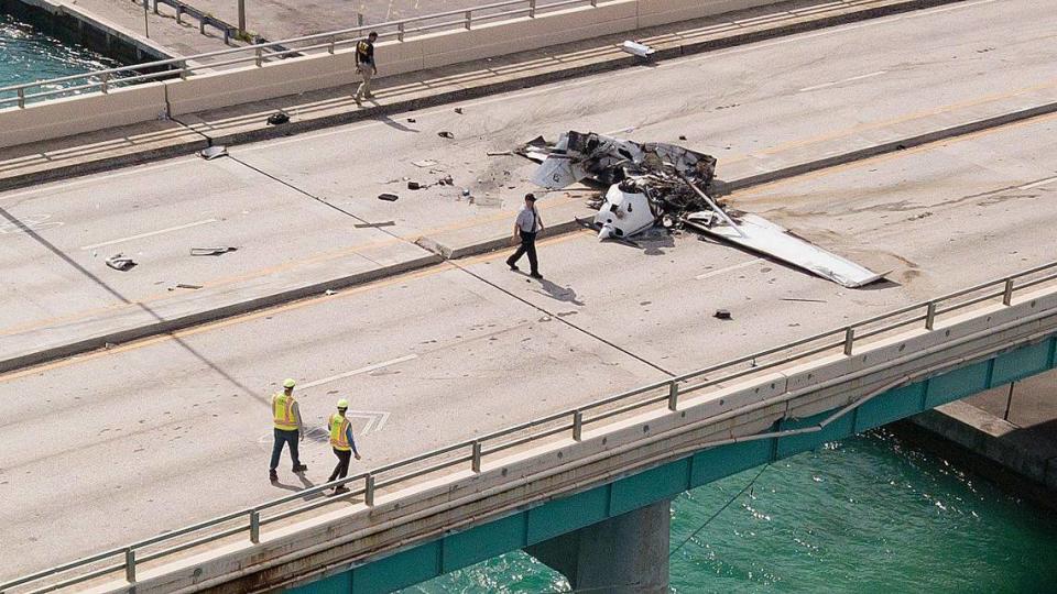 One killed and five injured when plane crashes on Haulover bridge, strikes a vehicle and catches fire in Miami-Dade on Saturday, May 14, 2022.