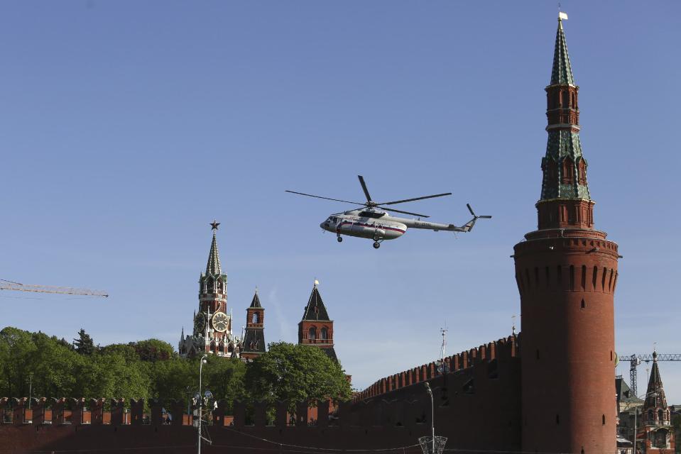 A Russian government helicopter lands at the Kremlin before a Victory Day Parade in Red Square in Moscow, Russia, Friday, May 9, 2014. Russia marked the Victory Day on May 9 holding a military parade in Red Square in Moscow. (AP Photo/Denis Tyrin)