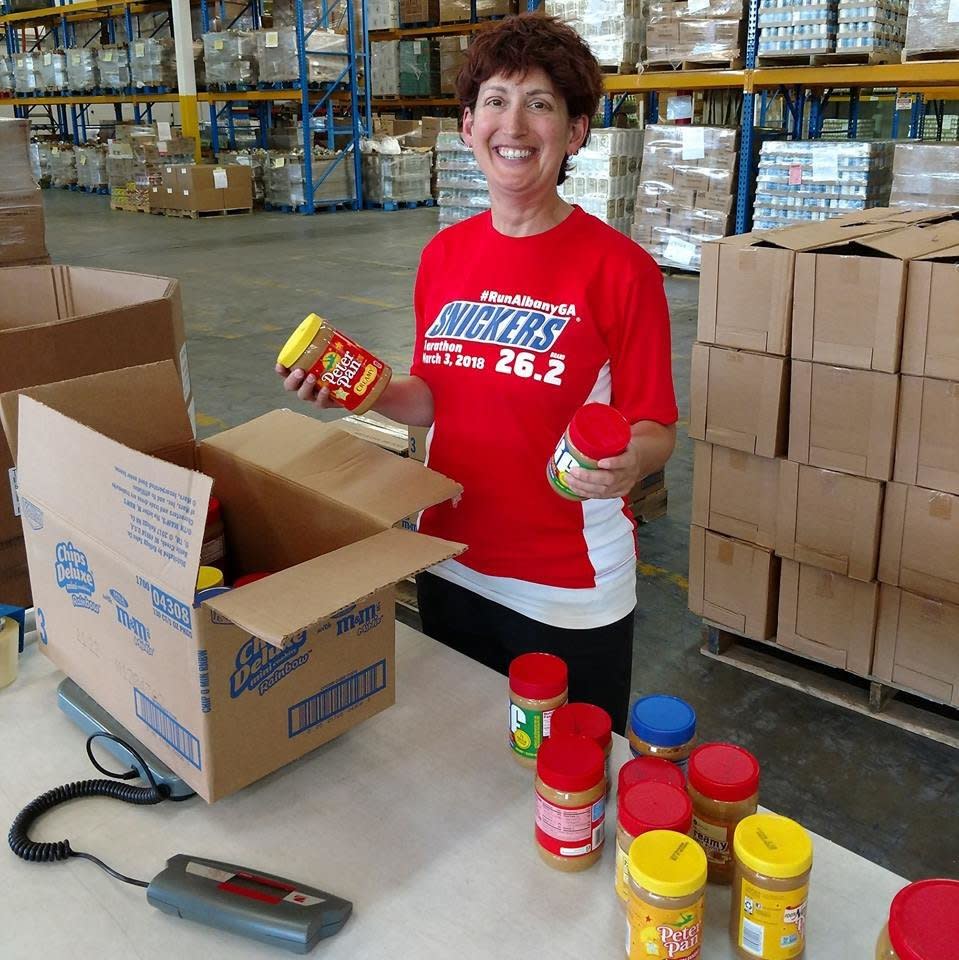 Boxing up peanut butters after a very successful food drive. Nut butters are a high-demand item, especially for kids, families and seniors. (Photo: Jess Kurti)