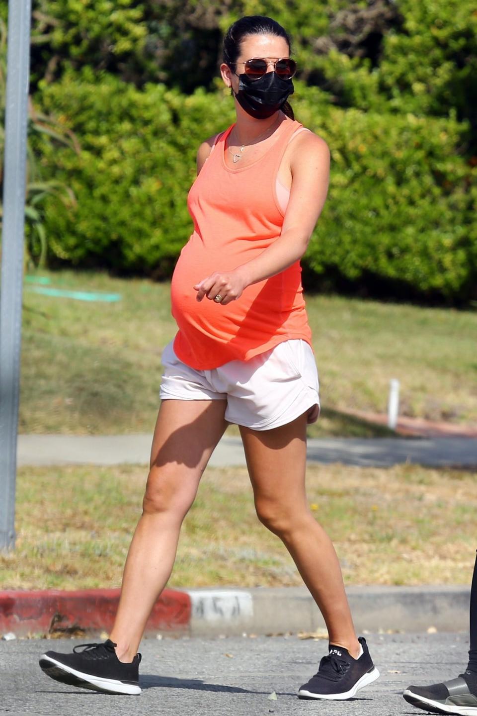 <p>Pregnant Lea Michele wears a face mask while out for a stroll on Tuesday in Santa Monica. </p>