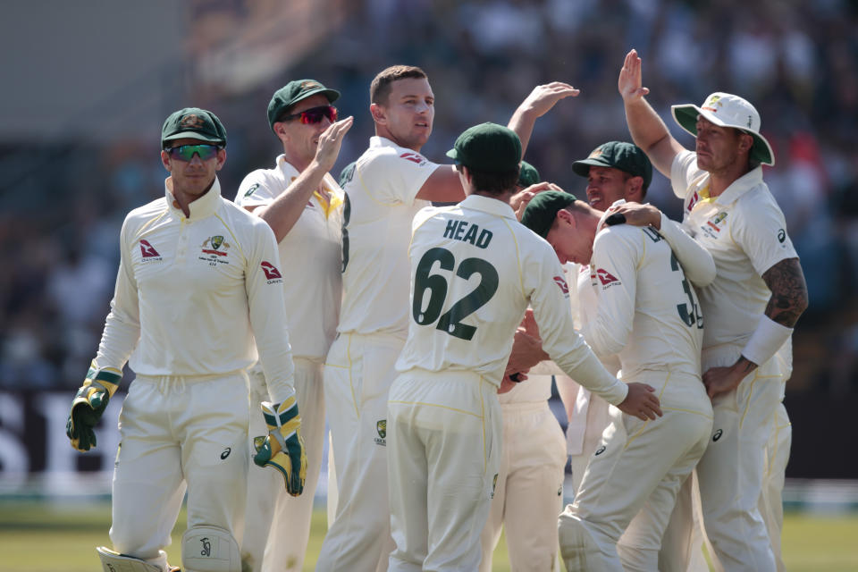 Australia's Josh Hazlewood, centre left, celebrates after taking the wicket of England's Jonny Bairstow, caught by Marnus Labuschagne for 36 on the fourth day of the 3rd Ashes Test cricket match between England and Australia at Headingley cricket ground in Leeds, England, Sunday, Aug. 25, 2019. (AP Photo/Jon Super)