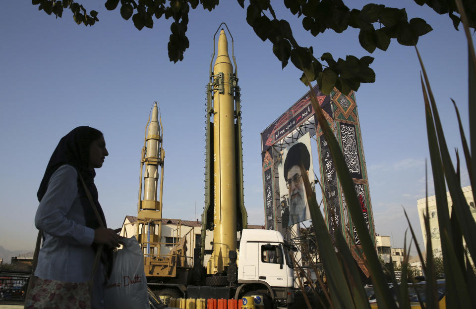 FILE-- In this Sept. 24, 2017 file photo, surface-to-surface missiles and a portrait of the Iranian Supreme Leader Ayatollah Ali Khamenei are displayed by the Revolutionary Guard in an exhibition marking the anniversary of outset of the 1980s Iran-Iraq war, at Baharestan Square in Tehran, Iran. On Monday, April 8, 2019, the Trump administration designated Iran’s Revolutionary Guard a “foreign terrorist organization” in an unprecedented move against a national armed force. Iran’s Revolutionary Guard Corps went from being a domestic security force with origins in the 1979 Islamic Revolution to a transnational fighting force. (AP Photo/Vahid Salemi, File)