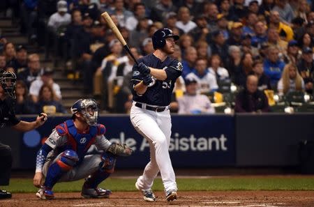 Oct 12, 2018; Milwaukee, WI, USA; Milwaukee Brewers relief pitcher Brandon Woodruff (53) hits a solo home run during the third inning against the Los Angeles Dodgers in game one of the 2018 NLCS playoff baseball series at Miller Park. Mandatory Credit: Benny Sieu-USA TODAY Sports