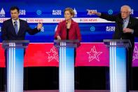 Candidates discuss an issue during the tenth Democratic 2020 presidential debate at the Gaillard Center in Charleston, South Carolina, U.S.