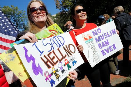 Protesters gather outside the White House for "NoMuslimBanEver" rally against what they say is discriminatory policies that unlawfully target American Muslim and immigrant communities, in Washington, U.S., October 18, 2017. REUTERS/Yuri Gripas