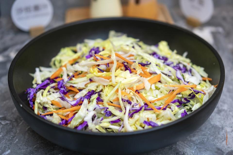 Vegetable salad in a black bowl