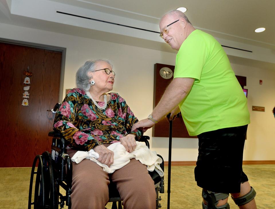 Wenonah Bish, who turns 111 on Monday, talks to Danny Williams, the owner of Seven To Heaven Hairdressers and Bish's former hairdresser. Williams was visiting his mother at the Villas Senior Care Community when they saw each other Thursday, Sept. 28, 2023.