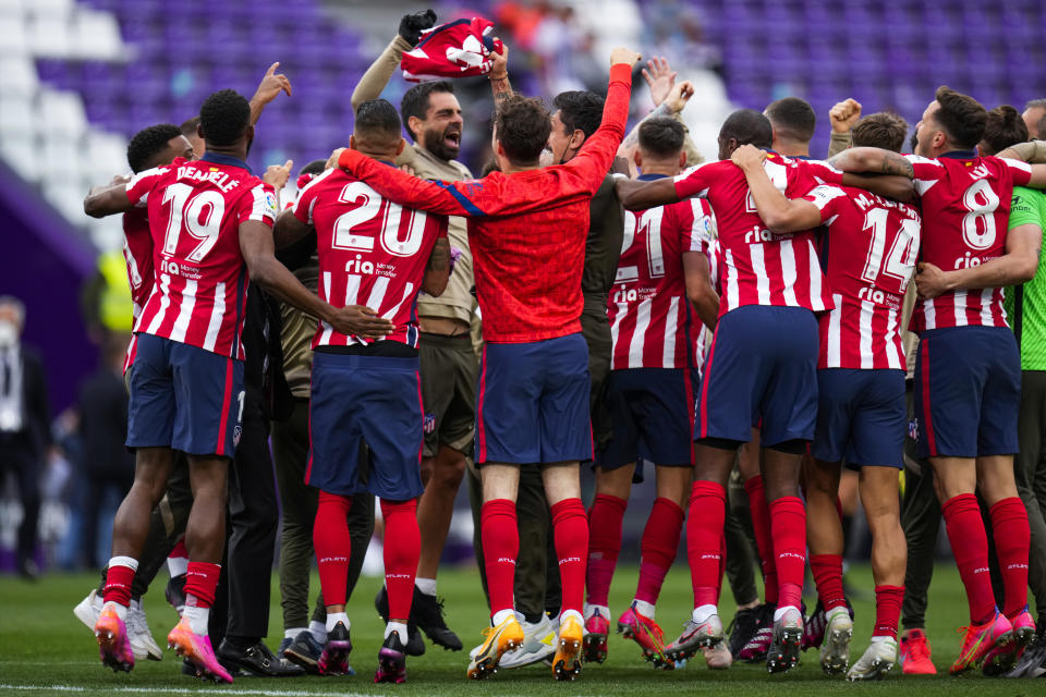 Atletico Madrid players jubilate at the end of the Spanish La Liga soccer match between Atletico Madrid and Valladolid at the Jose Zorrilla stadium in Valladolid, Spain, Saturday, May 22, 2021. Atletico won 2-1 and clinches its 11th Spanish La Liga title. (AP Photo/Manu Fernandez)