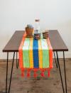 <p>Etsy</p><p><strong>$49.30</strong></p><p>Brighten up your kitchen table with this Mexican textile from Etsy designer OF Boutique. They make tons of handmade products you can put all over your home. </p>